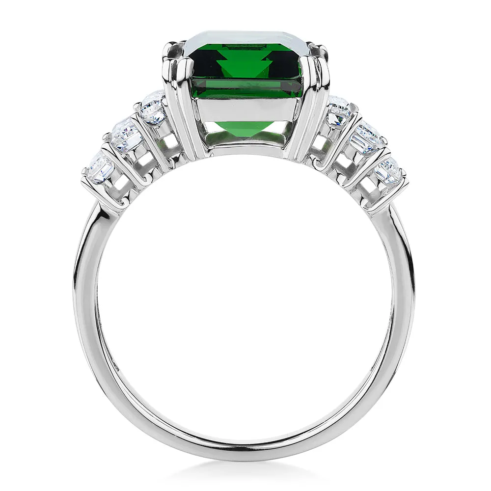 Dress ring with emerald simulant and 1.44 carats* of diamond simulants in 10 carat white gold